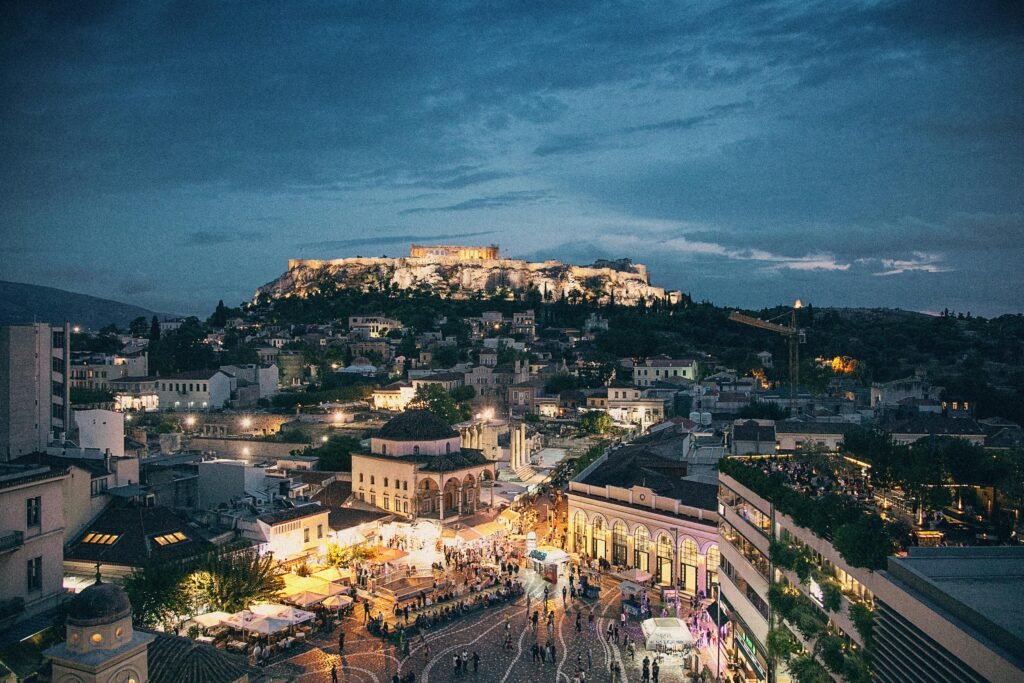 A mesmerizing night skyline of Athens featuring the illuminated Acropolis.